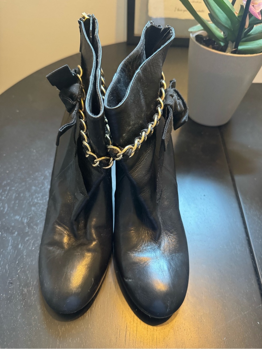 Kate Spade Women's Black Leather Ankle Boots with Gold Chain Accent